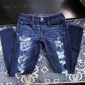 American Eagle ripped blue jeans